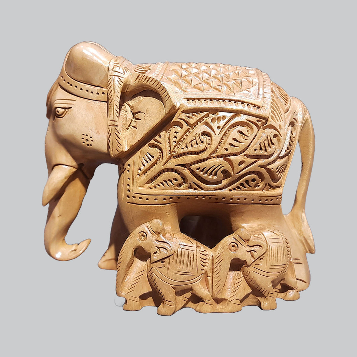 The Bombay Store Whitewood Elephant Family with Carving Down Trunk 4 in
